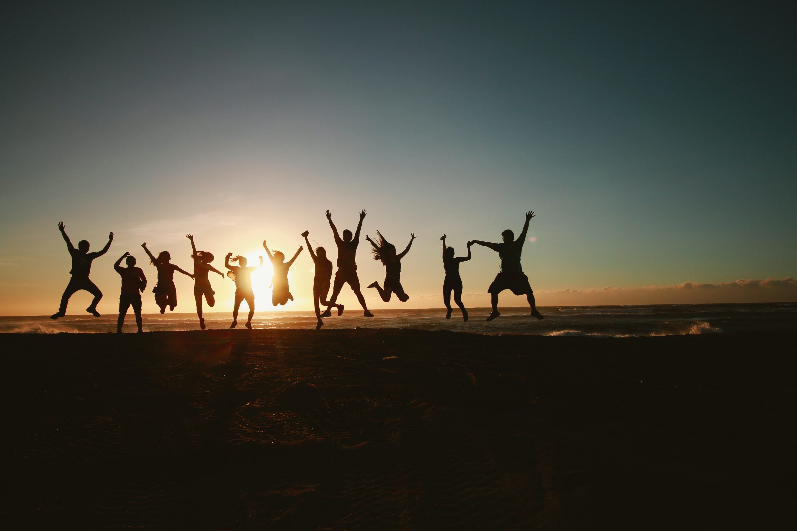 People Jumping for Joy, Rejoicing in the Sunset